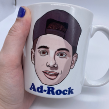 Load image into Gallery viewer, white ceramic mug with hand drawn portraits of the Beastie Boys - Ad-Rock, MCA and Mike D.